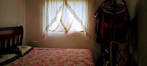 Ένα ή περισσότερα κρεβάτια σε δωμάτιο στο Casa De férias Santa cruz