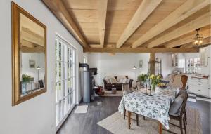 a dining room with a table and a living room at Cozy Home In Warendorf With Wifi in Warendorf