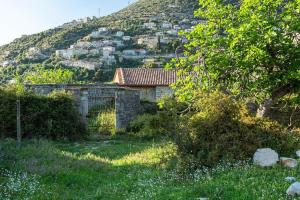 a house on the side of a hill at Color Villa - South Paradise 2 in Himare