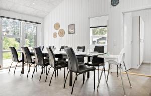 a dining room with a table and chairs at 4 Bedroom Lovely Home In Hals in Hals