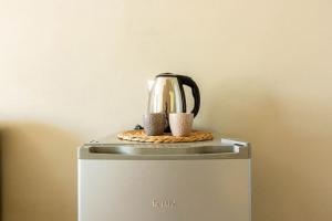 a tea kettle on top of a refrigerator at Color Villa - South Paradise 3 in Himare