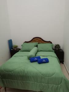 Postel nebo postele na pokoji v ubytování Dheeya Homestay + 1 fotografie