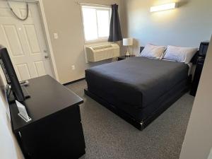 Postel nebo postele na pokoji v ubytování Come on Inn Motel