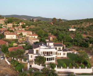 an aerial view of a large white house at Zografos Studios Zacharo Zakharo in Zacharo +66 photos