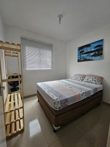 a bedroom with a bed and a ladder in it at Marques Beach House MCZ in Maceió