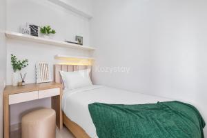 Ein Bett oder Betten in einem Zimmer der Unterkunft Mukava by Kozystay - Grogol