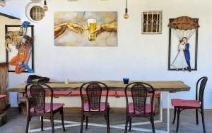 a dining room with a wooden table and chairs at Oludeniz Hostel in Fethiye