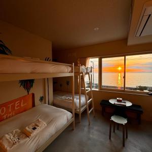 Postel nebo postele na pokoji v ubytování KAMOME SLOW HOTEL the COMPACT