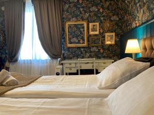 Postel nebo postele na pokoji v ubytování Madam Blå Hotel + 42 fotografií