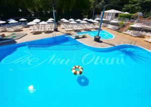 a swimming pool with a ball on top of it at Hotel New Otani Tokyo Garden Tower in Tokyo