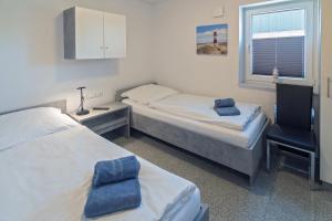 Postel nebo postele na pokoji v ubytování Ferienhaus Empora
