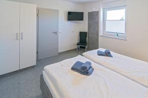 Postel nebo postele na pokoji v ubytování Ferienhaus Empora