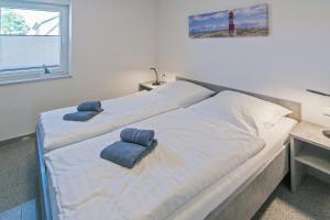 Postel nebo postele na pokoji v ubytování Ferienhaus Empora