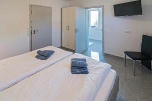 Postel nebo postele na pokoji v ubytování Ferienhaus Empora