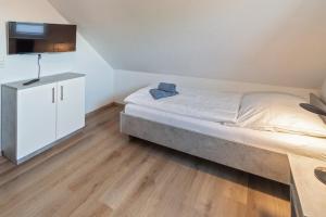 Postel nebo postele na pokoji v ubytování Ferienhaus Empora