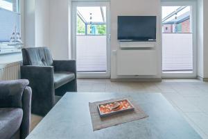TV a/nebo společenská místnost v ubytování Ferienwohnung Seestern