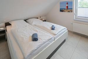Postel nebo postele na pokoji v ubytování Ferienwohnung Seestern