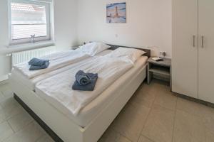 Postel nebo postele na pokoji v ubytování Ferienwohnung Seestern