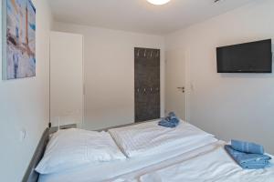 Postel nebo postele na pokoji v ubytování Ferienwohnung Seestern