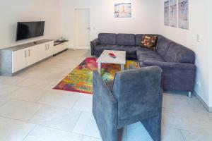 TV a/nebo společenská místnost v ubytování Ferienwohnung Strandläufer