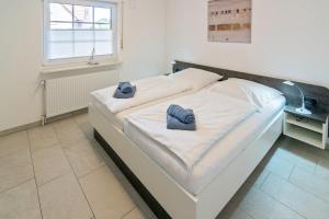 Postel nebo postele na pokoji v ubytování Ferienwohnung Strandläufer