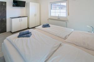Postel nebo postele na pokoji v ubytování Ferienwohnung Strandläufer