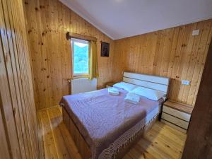Postel nebo postele na pokoji v ubytování Dariani Cottage