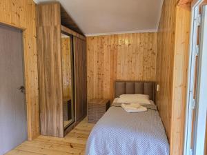 Postel nebo postele na pokoji v ubytování Dariani Cottage