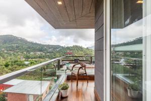 a balcony with a view of the mountains at Alaya Stays Celestial Rhapsody 3BHK Villa in Nainital in Nainital