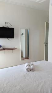 Postel nebo postele na pokoji v ubytování ARIMBI GUEST HOUSE