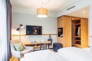 Posteľ alebo postele v izbe v ubytovaní harry's home Lienz hotel & apartments
