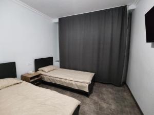 Postel nebo postele na pokoji v ubytování Hotel Talin