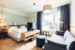 Postel nebo postele na pokoji v ubytování harry's home Lienz hotel & apartments + 37 fotografií