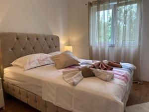 Postel nebo postele na pokoji v ubytování Apartments Manuel