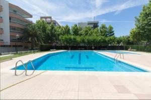 a large swimming pool in a building at La Siesta Apt in Salou