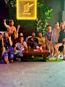 a group of people are posing for a picture at MBAR HOSTEL HAAD RIN in Haad Rin