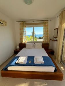 Ένα ή περισσότερα κρεβάτια σε δωμάτιο στο Horizon Bliss at Coral Bay