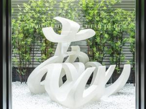 a large white sculpture in front of a building at La'gent Hotel Kyoto Nijo in Kyoto +188 photos
