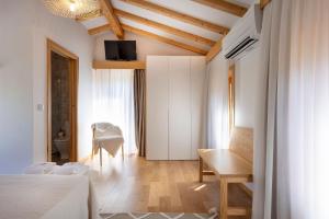 a bedroom with a bed and a table and a desk at Casa Ponte de Espindo in Lousada +15 photos