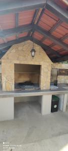 a bench in front of a stone wall at Villa Olive Island in Neviđane +66 photos