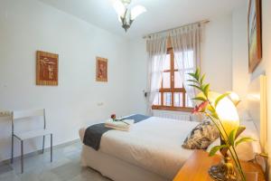 Postel nebo postele na pokoji v ubytování APARTAMENTO ADULTOS CENTRO N V 1 free parking