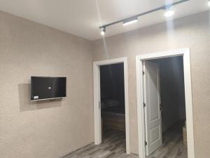 a room with a flat screen tv on the wall at Chai Kent in Gabala