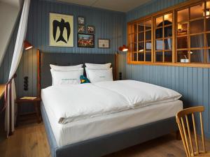 Postel nebo postele na pokoji v ubytování 25hours Hotel Paper Island