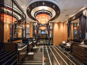 a lobby with a staircase and a chandelier at APA Hotel AkihabaraSuehirocho Ekimae -Electric Town- in Tokyo