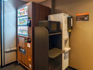 a refrigerator with a microwave in a room at APA Hotel AkihabaraSuehirocho Ekimae -Electric Town- in Tokyo