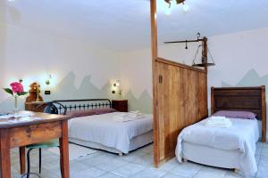 Postel nebo postele na pokoji v ubytování La Vrille - chambres d'hôtes