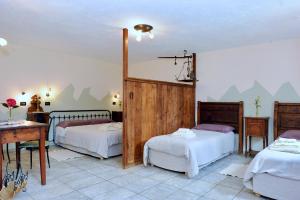 Postel nebo postele na pokoji v ubytování La Vrille - chambres d'hôtes