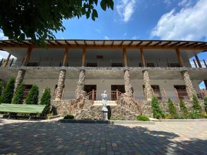 a building with a bench in front of it at More Nadezhd in Sanzhiyka