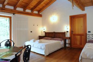 Postel nebo postele na pokoji v ubytování La Vrille - chambres d'hôtes