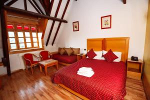 Postel nebo postele na pokoji v ubytování Grand Hotel Ifrane